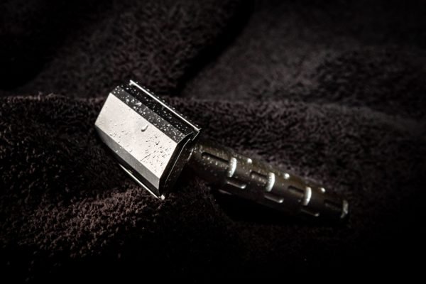 The Goodfellas' Smile Syntesi Safety Razor – Stainless Steel Three-Piece head up on towel
