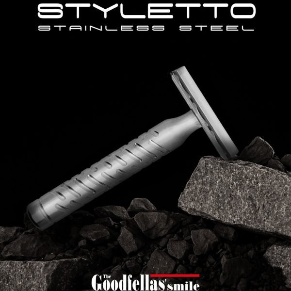 The Goodfellas’ Smile Styletto V2 stainless steel safety razor lifestyle photo on rocks, black background