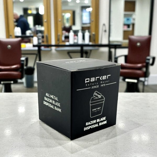 Parker blade disposal bank holding up to 300 used razor blades with box on barber counter