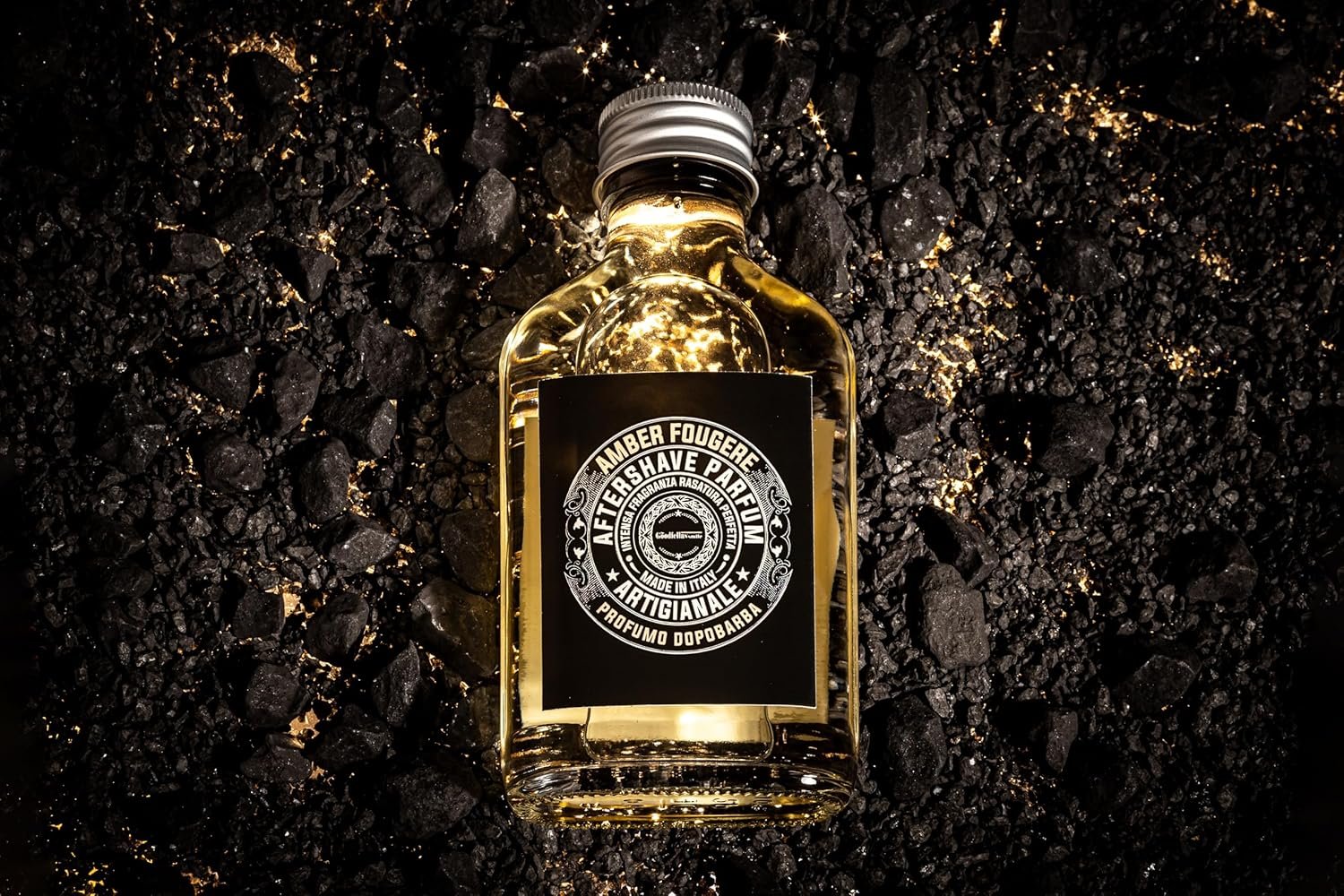 The Goodfellas’ Smile Amber Fougere Aftershave 100ml bottle and box on rocks