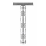 The Goodfellas' Smile Dominus double-edge safety razor in polished chrome, shown upright against a white background