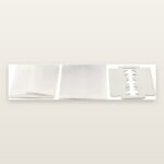 Loose KAI Stainless double edge razor blades in individual paper wrappers with one unwrapped blade, sold by the blade
