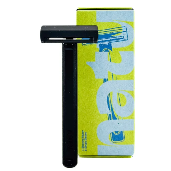 NATU single edge pivot head safety razor with a solid black anodised aluminium handle, shown with its retail box