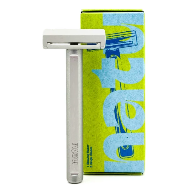 NATU single edge pivot head safety razor with a light grey silver anodised aluminium handle, shown with its retail box