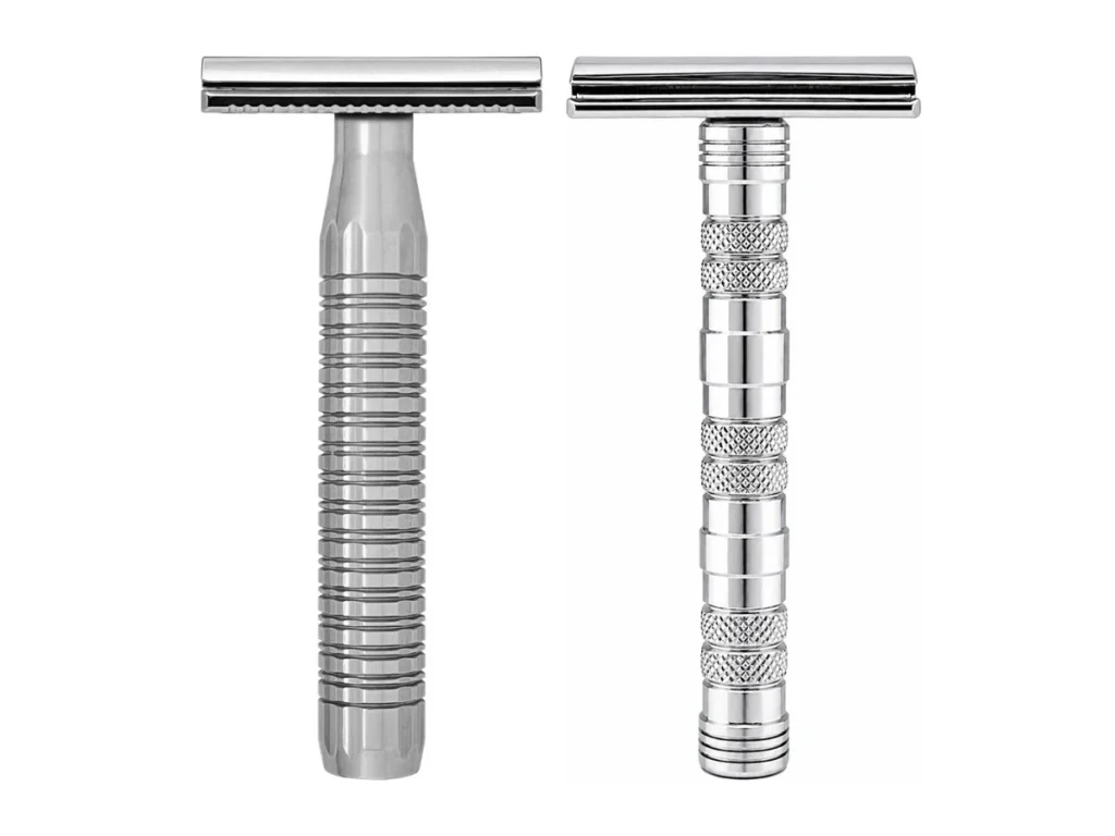 The Goodfellas' Smile Lybra solid 316L stainless safety razor beside the chrome plated brass Dominus razor on a white background