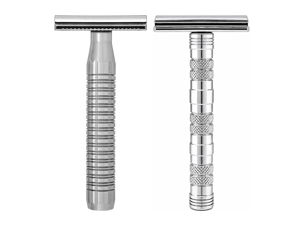 The Goodfellas' Smile Lybra solid 316L stainless safety razor beside the chrome plated brass Dominus razor on a white background