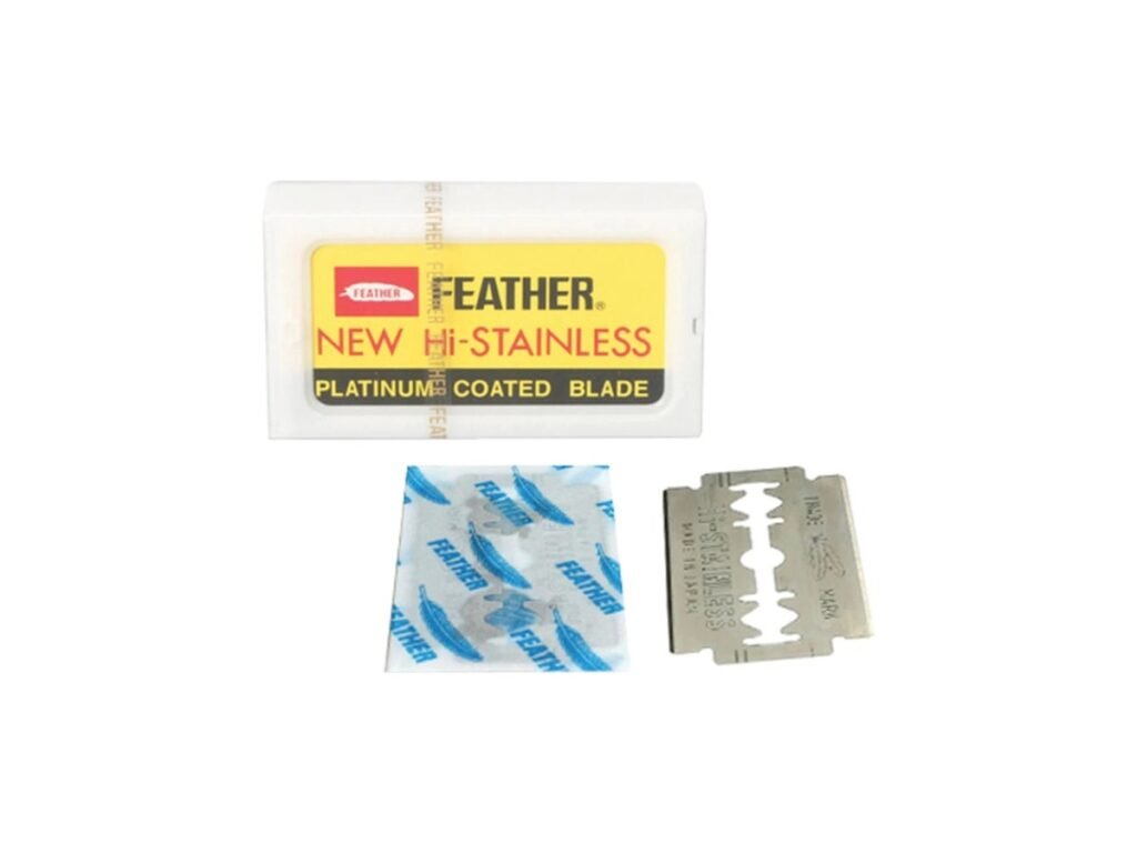 Feather Hi-Stainless platinum coated double edge razor blade tuck with one wrapped blade and one unwrapped blade