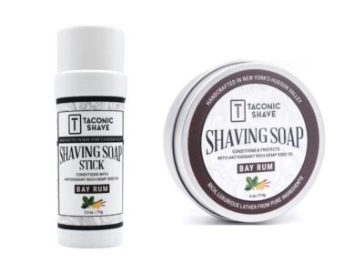 Taconic Bay Rum shaving soap stick beside the Taconic Bay Rum 4 oz shaving soap puck in its tin