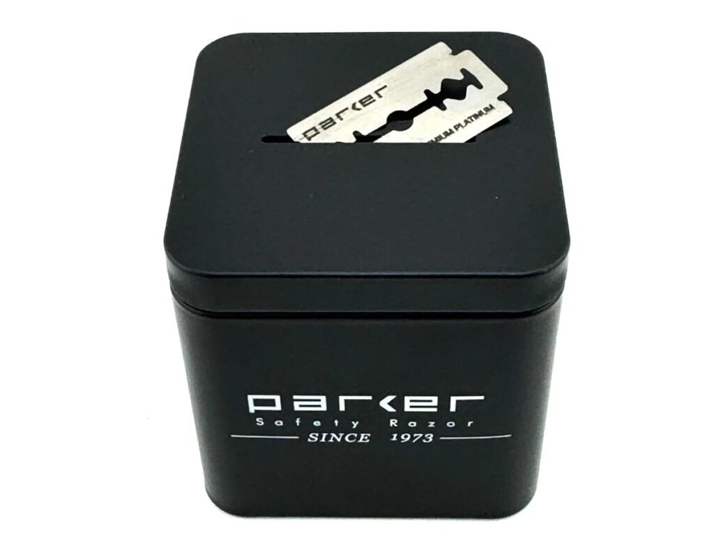 Parker all metal double edge blade disposal bank with a used razor blade in the slot