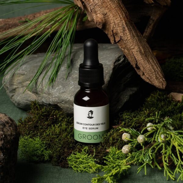 GROOM Eye Serum 15 ml shown with cedar, moss and stone