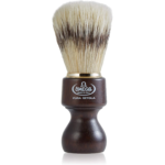 Omega boar bristle shaving brush with a waisted dark stained wood handle and brass collar, marked Pura Setola